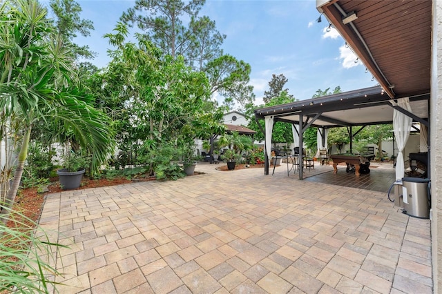 view of patio / terrace featuring a gazebo and outdoor dining space