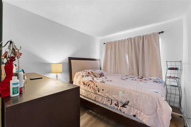 bedroom with wood finished floors