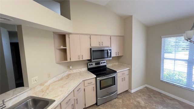 4175 N Stewart Way, Beverly Hills, FL 34465 - kitchen with appliances with stainless steel finishes, light countertops, lofted ceiling, and open shelves