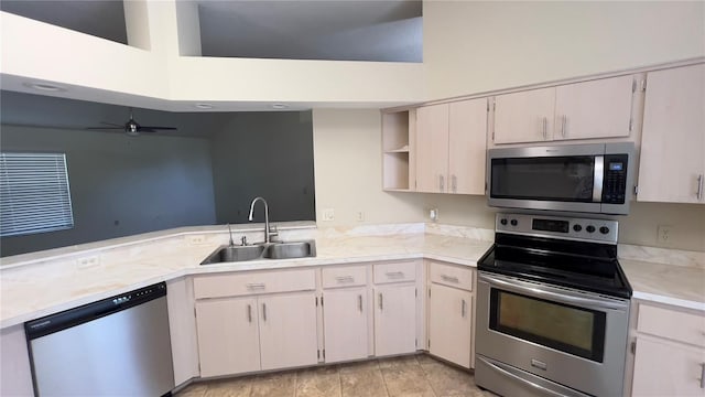4175 N Stewart Way, Beverly Hills, FL 34465 - kitchen with appliances with stainless steel finishes, light countertops, a ceiling fan, a peninsula, and open shelves