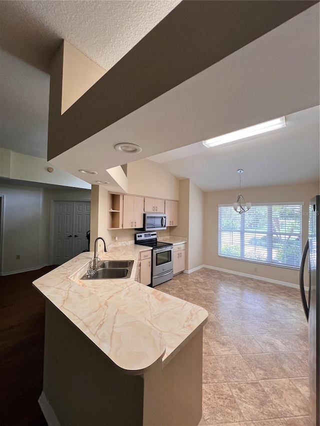 4175 N Stewart Way, Beverly Hills, FL 34465 - kitchen with appliances with stainless steel finishes, light countertops, a peninsula, open shelves, and a chandelier