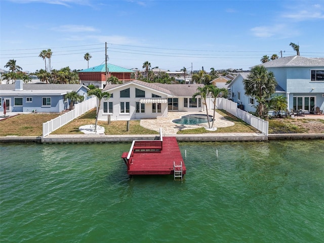 600 115th Ave, Treasure Island, FL 33706 - dock with a fenced backyard, a water view, and a patio area