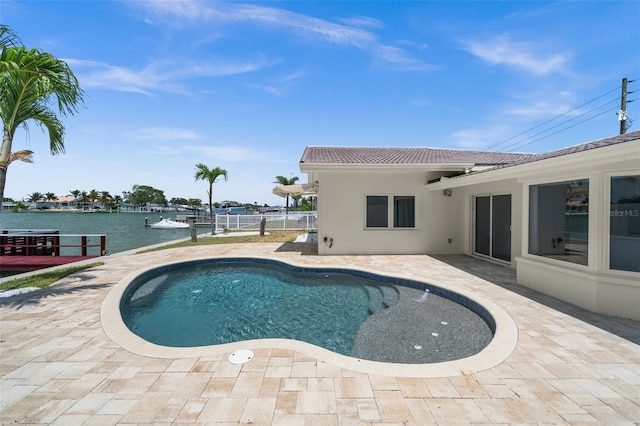 600 115th Ave, Treasure Island, FL 33706 - swimming pool featuring a patio and a water view