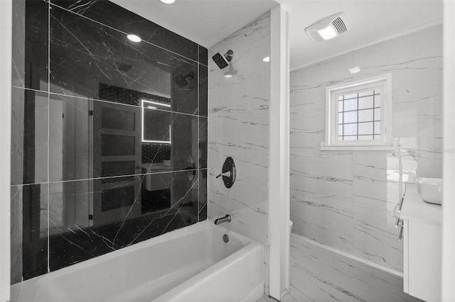 600 115th Ave, Treasure Island, FL 33706 - bathroom with vanity, washtub / shower combination, and marble finish flooring