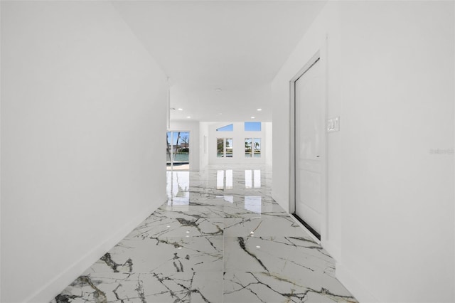 600 115th Ave, Treasure Island, FL 33706 - hallway featuring marble tiled flooring and recessed lighting