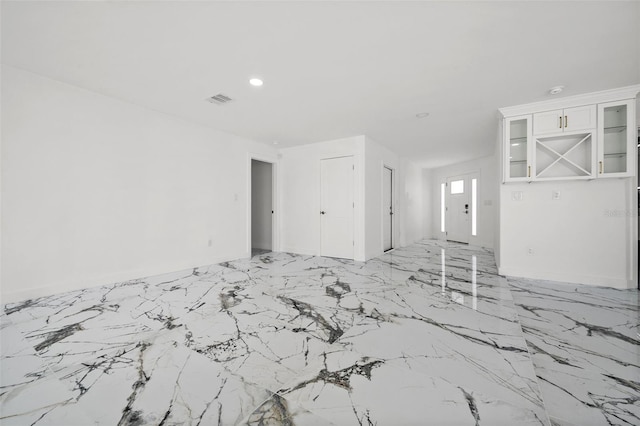 600 115th Ave, Treasure Island, FL 33706 - empty room with light marble finish flooring and recessed lighting