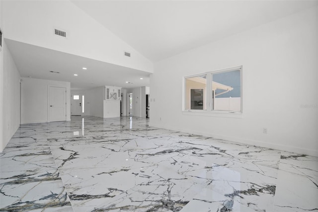 600 115th Ave, Treasure Island, FL 33706 - unfurnished living room featuring marble finish floors, high vaulted ceiling, and recessed lighting