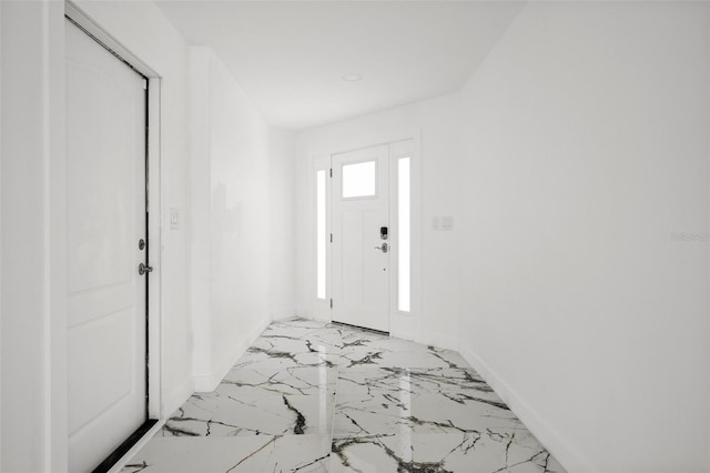 600 115th Ave, Treasure Island, FL 33706 - entryway with baseboards and light marble finish floors