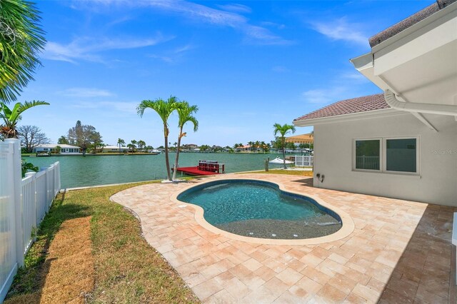 600 115th Ave, Treasure Island, FL 33706 - swimming pool with a patio, a water view, and a fenced backyard