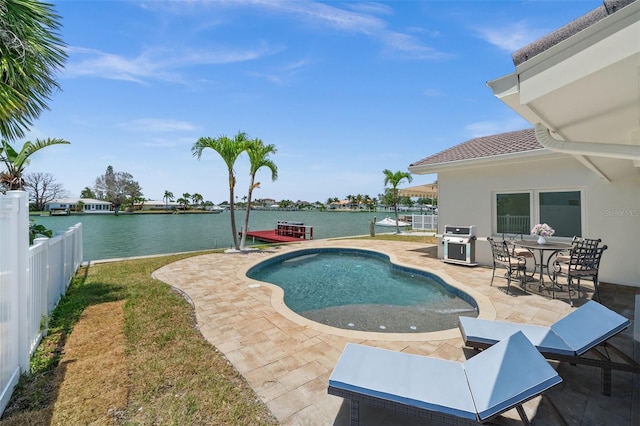 600 115th Ave, Treasure Island, FL 33706 - swimming pool with a patio, a water view, a grill, and a fenced backyard