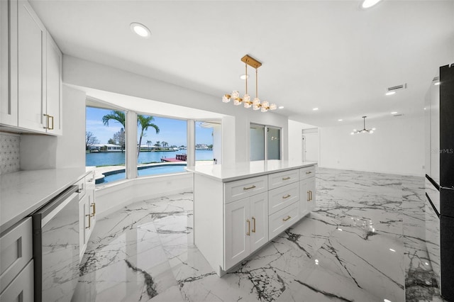 600 115th Ave, Treasure Island, FL 33706 - kitchen featuring a chandelier, recessed lighting, a water view, light countertops, and stainless steel dishwasher