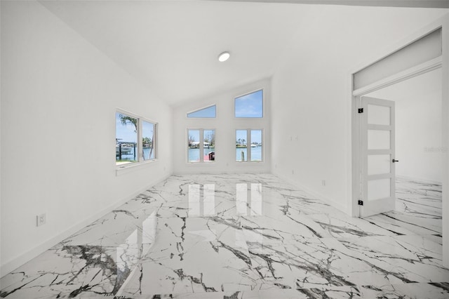 600 115th Ave, Treasure Island, FL 33706 - empty room featuring marble tiled floors and a water view
