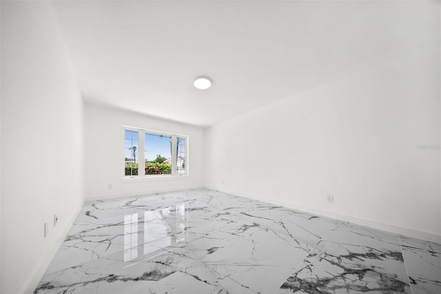 600 115th Ave, Treasure Island, FL 33706 - unfurnished room featuring marble finish flooring