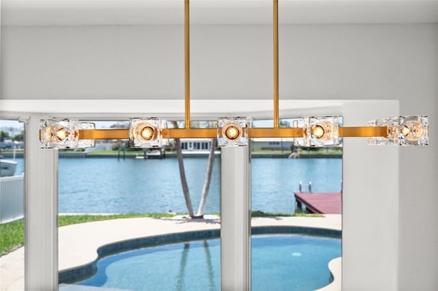 600 115th Ave, Treasure Island, FL 33706 - swimming pool featuring a water view, a boat dock, and boat lift