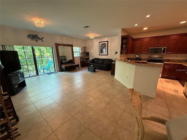 2924 Hidden Harbour Ct, Fort Lauderdale, FL 33312 - kitchen featuring open floor plan, recessed lighting, appliances with stainless steel finishes, light tile patterned floors, and open shelves