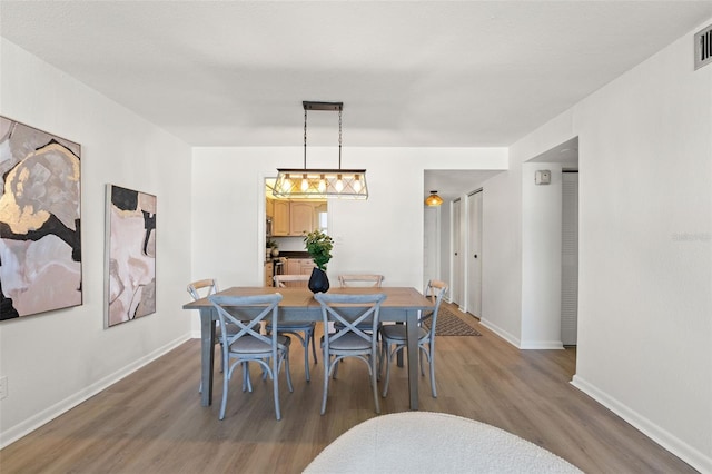 1230 Gulf Blvd Unit 1406, Clearwater Beach, FL 33767 - dining room with wood finished floors and baseboards