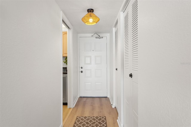 1230 Gulf Blvd Unit 1406, Clearwater Beach, FL 33767 - hallway with light wood-style flooring and baseboards