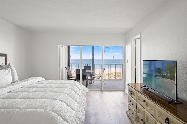 1230 Gulf Blvd Unit 1406, Clearwater Beach, FL 33767 - bedroom featuring access to outside and light wood-style floors