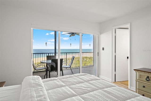 1230 Gulf Blvd Unit 1406, Clearwater Beach, FL 33767 - bedroom featuring access to outside, a water view, and wood finished floors