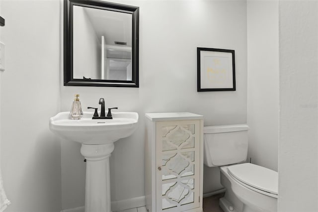 1230 Gulf Blvd Unit 1406, Clearwater Beach, FL 33767 - bathroom with toilet and tile patterned flooring