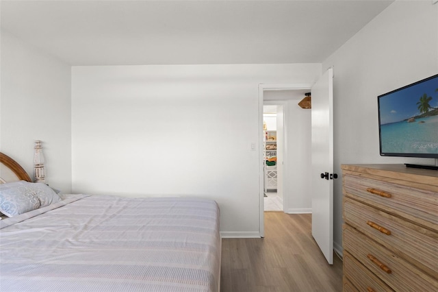 1230 Gulf Blvd Unit 1406, Clearwater Beach, FL 33767 - bedroom featuring wood finished floors and baseboards