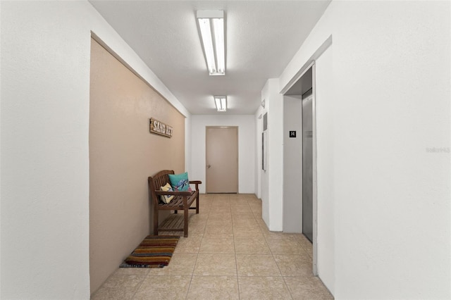 1230 Gulf Blvd Unit 1406, Clearwater Beach, FL 33767 - hallway featuring elevator and light tile patterned floors