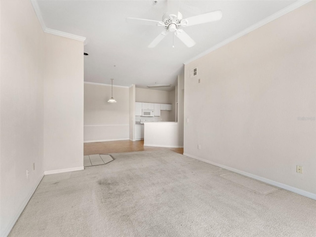 18107 Peregrines Perch Pl Unit 6302, Lutz, FL 33558 - unfurnished living room with light carpet, ornamental molding, and a ceiling fan