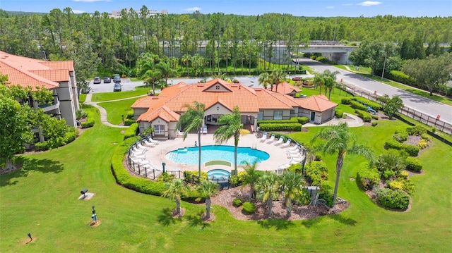 18107 Peregrines Perch Pl Unit 6302, Lutz, FL 33558 - view of subject property with a pool area and a heavily wooded area