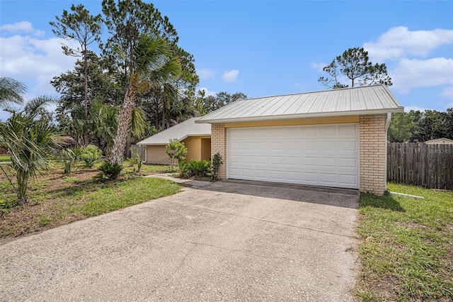1902 Cedarbrooke Dr, Lutz, FL 33549 - view of front of house with brick siding, a metal roof, and concrete driveway