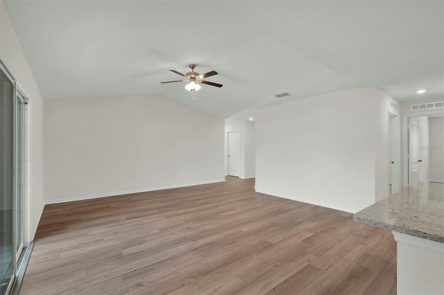 7504 SW 128th St, Ocala, FL 34473 - unfurnished living room featuring a ceiling fan, light wood finished floors, lofted ceiling, and recessed lighting
