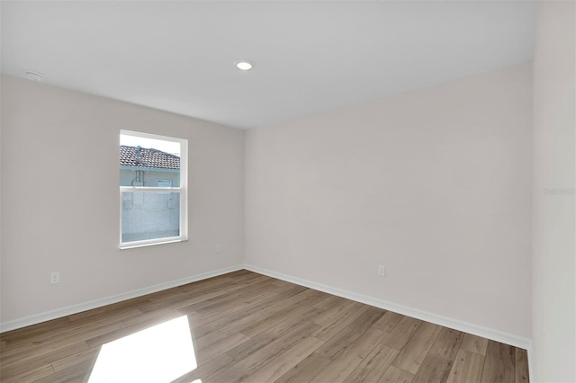 7504 SW 128th St, Ocala, FL 34473 - empty room with light wood-style flooring and recessed lighting