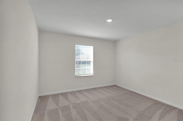 7504 SW 128th St, Ocala, FL 34473 - carpeted empty room featuring baseboards and recessed lighting