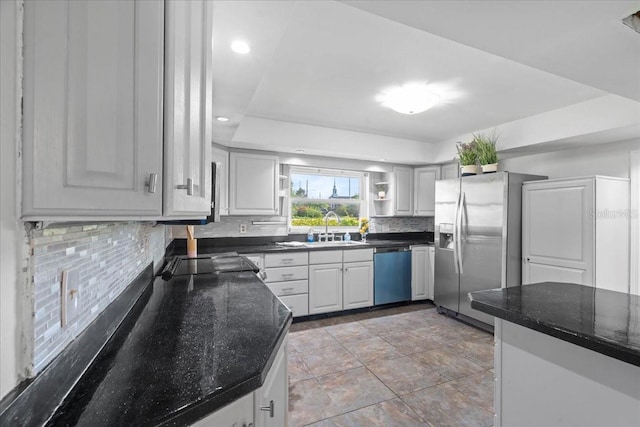 903 Tomahawk Trl, Brandon, FL 33511 - kitchen with decorative backsplash, open shelves, dishwashing machine, dark stone countertops, and stainless steel fridge