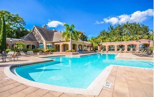 view of pool featuring a patio