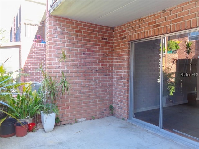 property entrance with a patio area