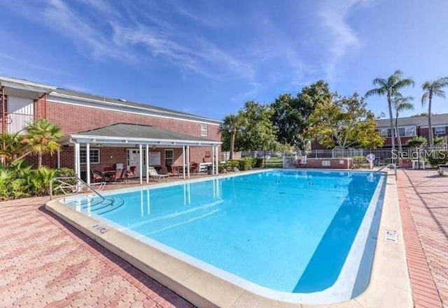 view of pool featuring a patio