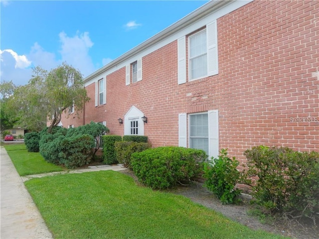 view of home's exterior featuring a yard