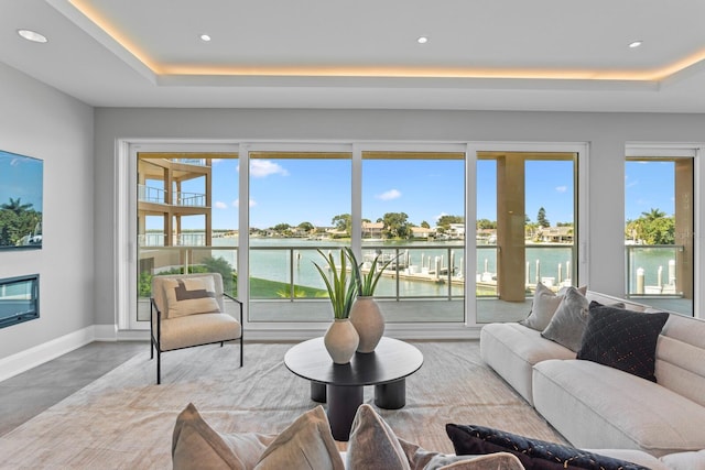 living room with a water view and a wealth of natural light