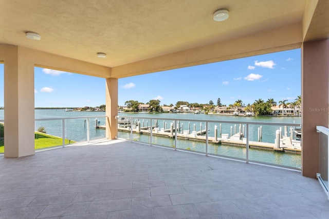 view of patio with a water view