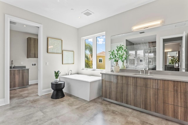 bathroom with vanity, separate shower and tub, and concrete flooring