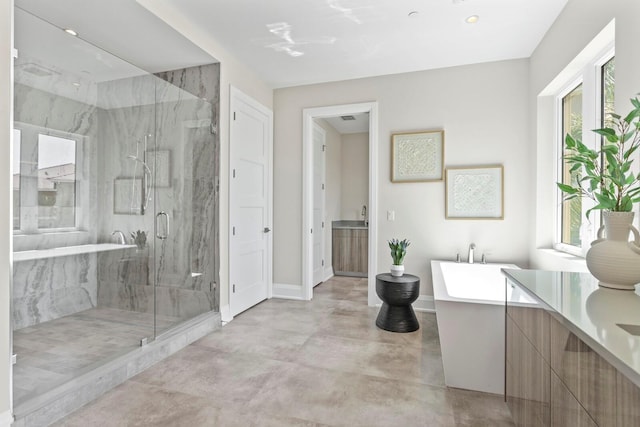 bathroom with independent shower and bath and concrete floors