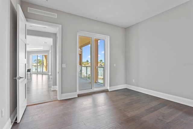 empty room featuring dark hardwood / wood-style floors