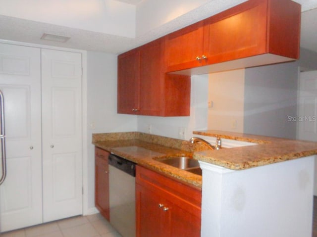 kitchen with light tile flooring, light stone countertops, kitchen peninsula, dishwasher, and sink