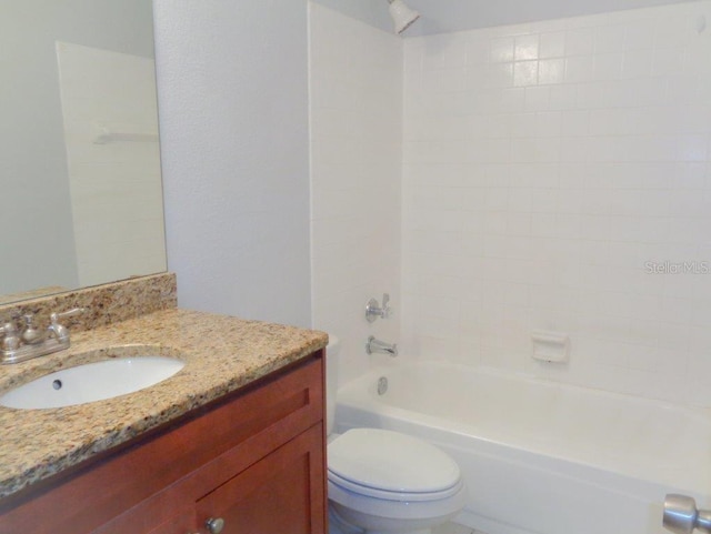 full bathroom featuring shower / bath combination, vanity, and toilet