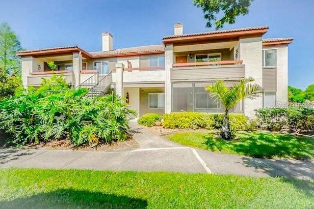 mediterranean / spanish-style home with a balcony