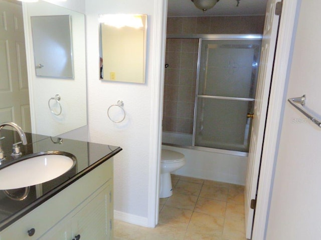 full bathroom with shower / bath combination with glass door, toilet, large vanity, and tile floors