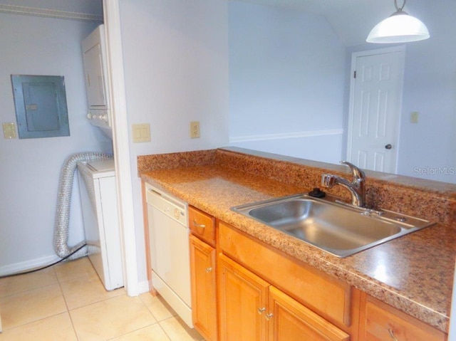 kitchen featuring white dishwasher, decorative light fixtures, light tile flooring, and sink