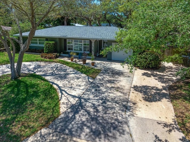 single story home featuring a garage