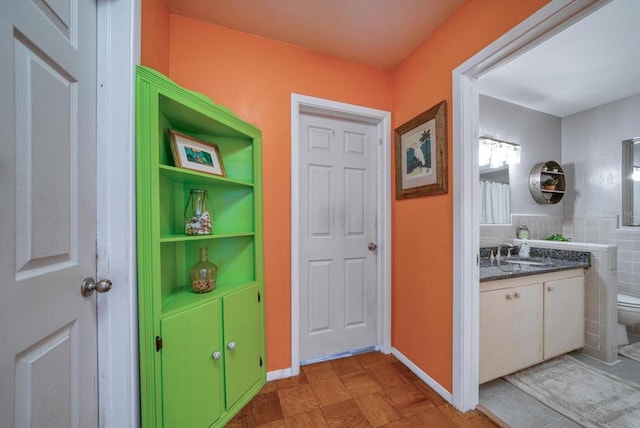 bathroom featuring toilet and vanity