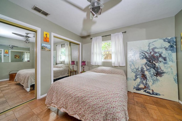 bedroom with light tile floors, multiple windows, a closet, and ceiling fan